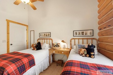 Perched on a half-acre of pristine land, this full-log retreat - photo 25