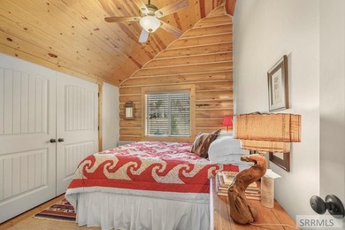 Perched on a half-acre of pristine land, this full-log retreat - photo 27