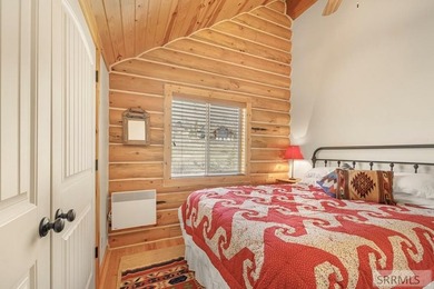 Perched on a half-acre of pristine land, this full-log retreat - photo 28