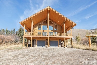 Perched on a half-acre of pristine land, this full-log retreat - photo 35