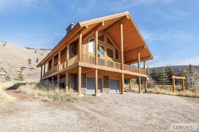 Perched on a half-acre of pristine land, this full-log retreat - photo 36