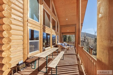 Perched on a half-acre of pristine land, this full-log retreat - photo 38