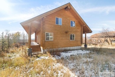 Perched on a half-acre of pristine land, this full-log retreat - photo 39