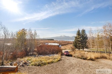 Perched on a half-acre of pristine land, this full-log retreat - photo 40