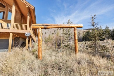 Perched on a half-acre of pristine land, this full-log retreat - photo 42