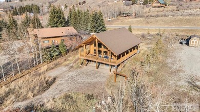 Perched on a half-acre of pristine land, this full-log retreat - photo 45