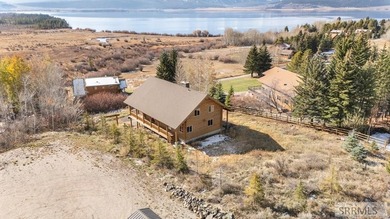 Perched on a half-acre of pristine land, this full-log retreat - photo 46
