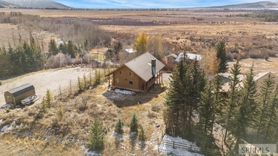 Perched on a half-acre of pristine land, this full-log retreat - photo 48