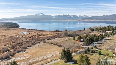 Perched on a half-acre of pristine land, this full-log retreat - photo 49