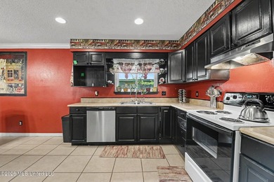 Move-in ready and packed with updates! This 4-bedroom, 2-bath - photo 7