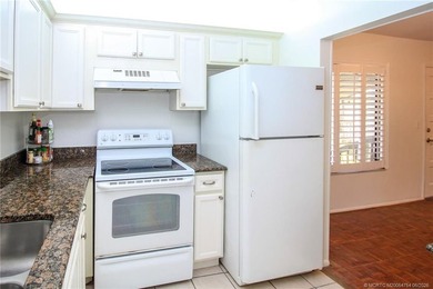 Welcome to this quaint 2-bedroom, 2-bath condo nestled among - photo 7