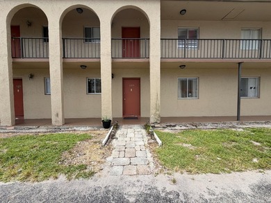 Ground-floor convenience meets low-maintenance living in this - photo 1