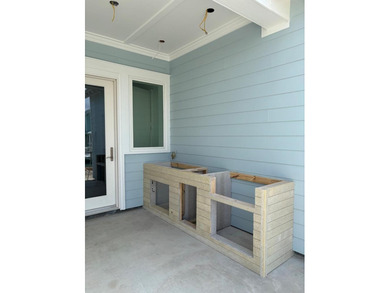 Experience coastal living at its finest in this stunning new - photo 8