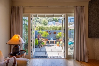 This exquisitely updated townhome enjoys privacy, sunshine, and - photo 1