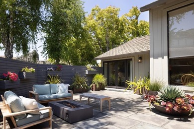 This exquisitely updated townhome enjoys privacy, sunshine, and - photo 8