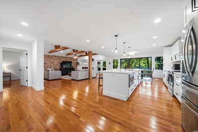 Tucked away on a large 1-acre waterfront lot, this fully - photo 12