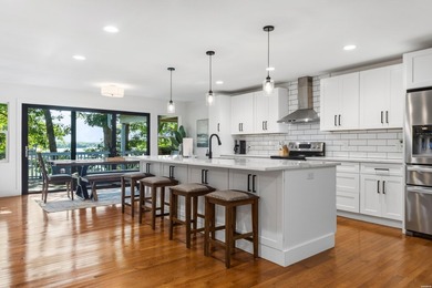 Tucked away on a large 1-acre waterfront lot, this fully - photo 17