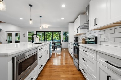 Tucked away on a large 1-acre waterfront lot, this fully - photo 20