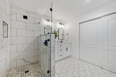 Tucked away on a large 1-acre waterfront lot, this fully - photo 28