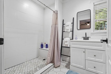 Tucked away on a large 1-acre waterfront lot, this fully - photo 38