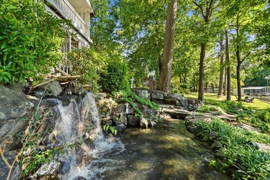 Tucked away on a large 1-acre waterfront lot, this fully - photo 44
