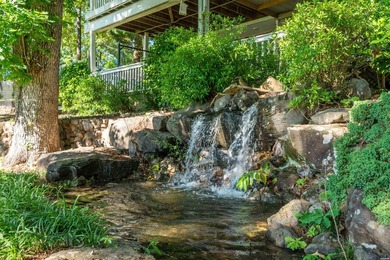 Tucked away on a large 1-acre waterfront lot, this fully - photo 45