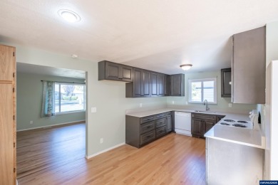 This property hosts both a main home & a studio with alley