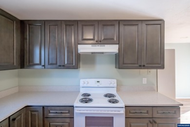 This property hosts both a main home & a studio with alley