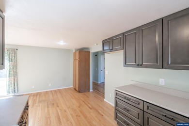 This property hosts both a main home & a studio with alley