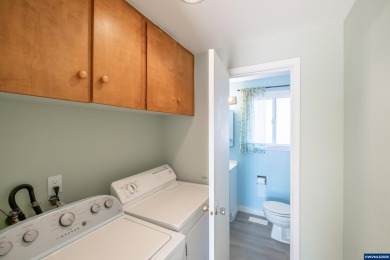 This property hosts both a main home & a studio with alley