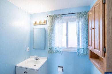 This property hosts both a main home & a studio with alley