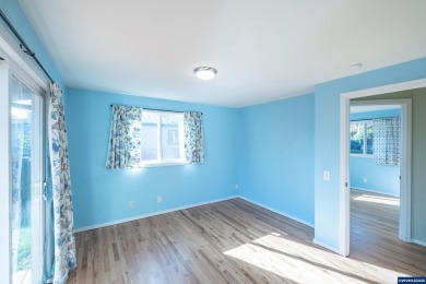 This property hosts both a main home & a studio with alley