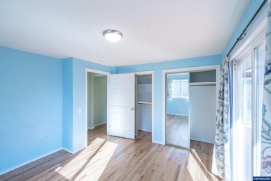 This property hosts both a main home & a studio with alley