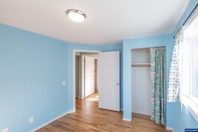 This property hosts both a main home & a studio with alley