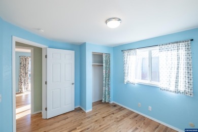 This property hosts both a main home & a studio with alley