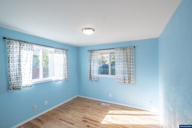 This property hosts both a main home & a studio with alley