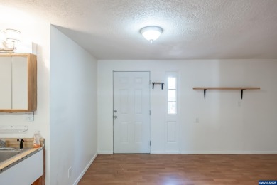 This property hosts both a main home & a studio with alley