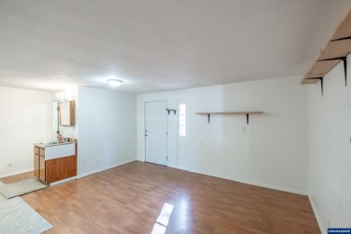 This property hosts both a main home & a studio with alley