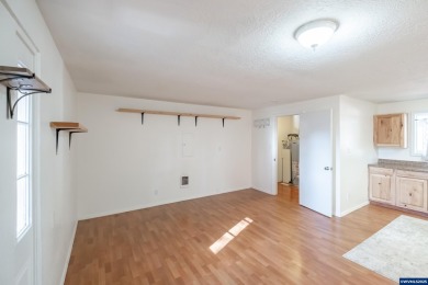 This property hosts both a main home & a studio with alley