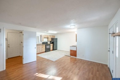 This property hosts both a main home & a studio with alley