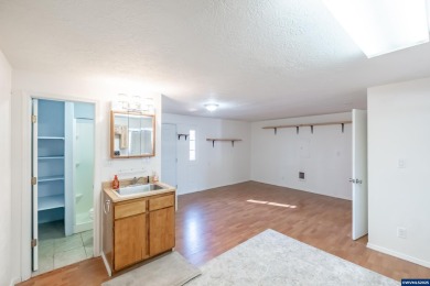 This property hosts both a main home & a studio with alley