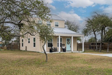 Nestled in the waterfront community of Holiday Beach, this - photo 4