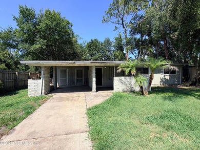Opportunity awaits! This 1,644-square-foot concrete block home - photo 1