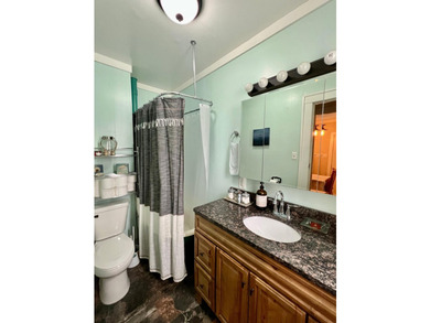 Experience lakefront living in this charming little home on Big - photo 10