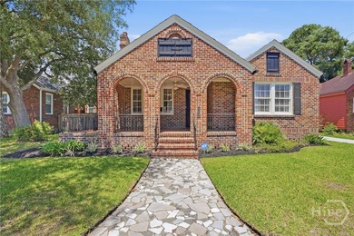 This charming 3-bedroom, 2-bath brick home in highly - photo 1