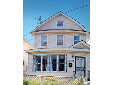 Welcome to this legal two-family home located in Jamaica, Queens - photo 1