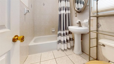 Welcome to this legal two-family home located in Jamaica, Queens - photo 4