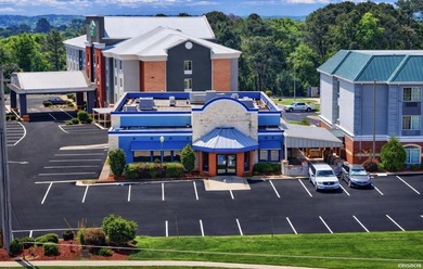 Located within a thriving hotel and restaurant development, this - photo 2