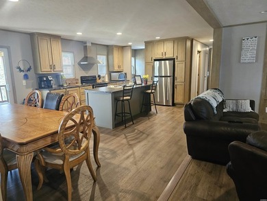 Double wide mobile home offering 5 bedrooms and 3 bathrooms on - photo 3