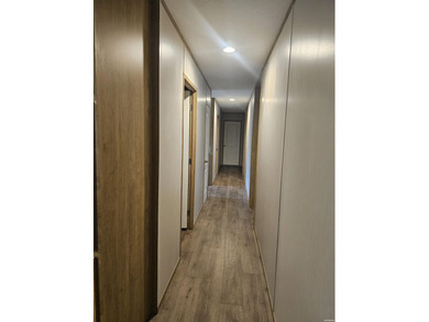 Double wide mobile home offering 5 bedrooms and 3 bathrooms on - photo 7